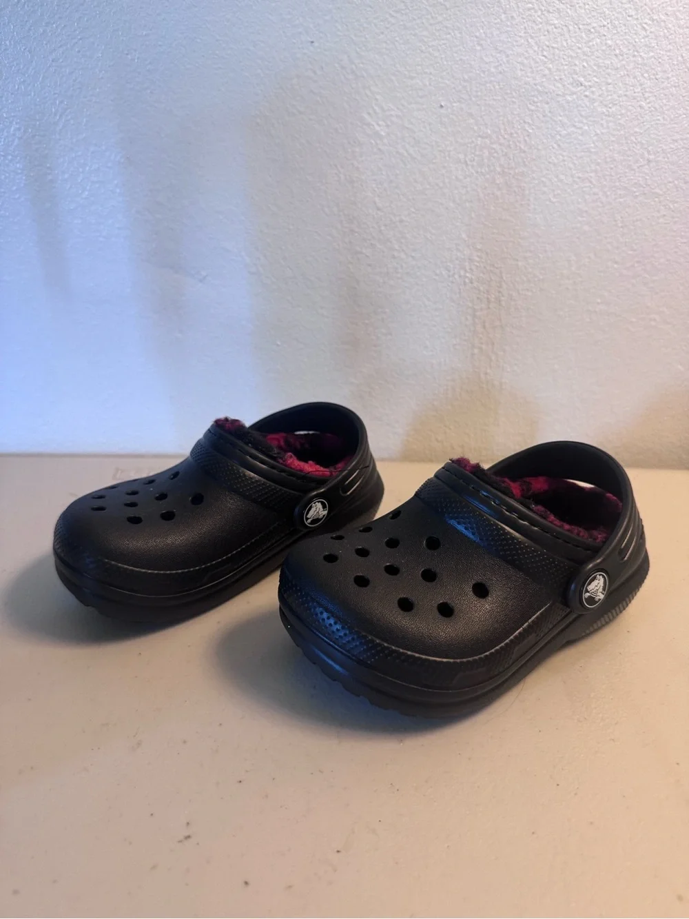 CROCS Kids Black Clogs with Pink Fleece Lining